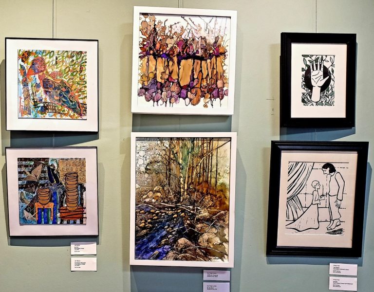 framed paintings hanging on wall