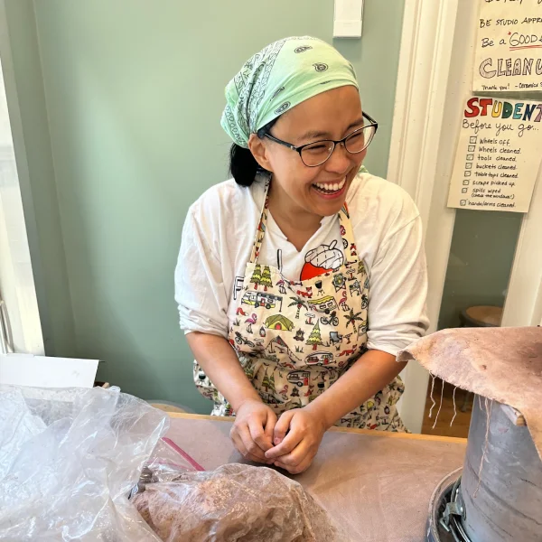 Adult student hand-building with clay