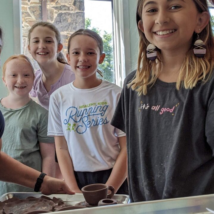 four young pottery students