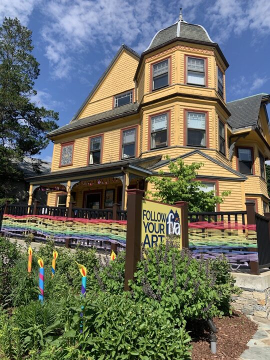 follow your art community studios exterior building on sunny day