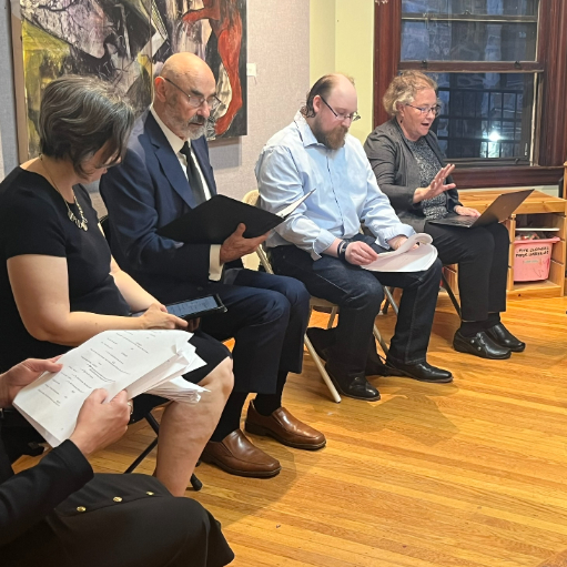 Writers-in-residence doing a dramatic reading of a play at Follow Your Art