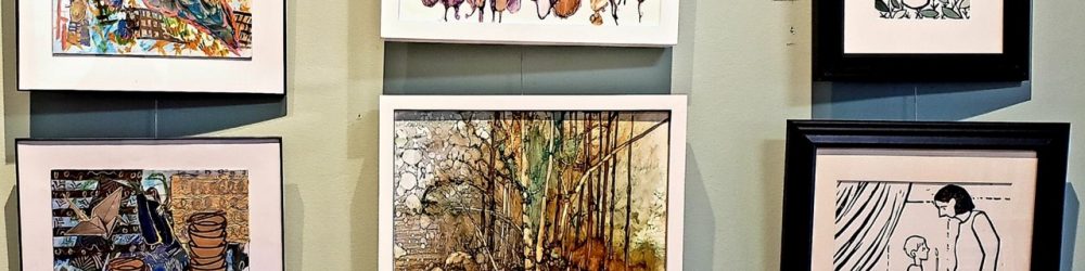 framed paintings hanging on wall